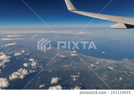 Aerial photograph of Ise Bay and the city of Tsu, Mie Prefecture, taken from a passenger plane flying over the city. Aerial photograph of Ise Bay and the city of Tsu, Mie Prefecture, taken from a passenger plane flying over the city. 141114035