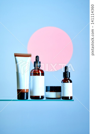 Skincare cosmetic products mock up on glass shelf with pink circle Skincare cosmetic products mock up on glass shelf with pink circle 141114360