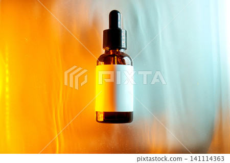 Amber dropper bottle with cosmetic serum product mockup 141114363