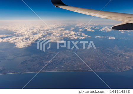 An aerial view of the Enshu Sea and Tenryu River from above Hamamatsu City, Shizuoka Prefecture, taken from an airplane. 141114388