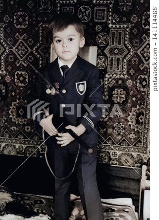 Young Boy Holding a Toy Rifle in Dnipropetrovsk, Ukraine, September 1971 Young Boy Holding a Toy Rifle in Dnipropetrovsk, Ukraine, September 1971 141114488
