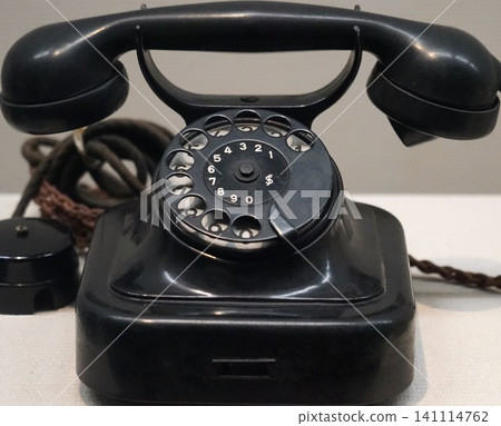 Old black telephone Old black telephone 141114762