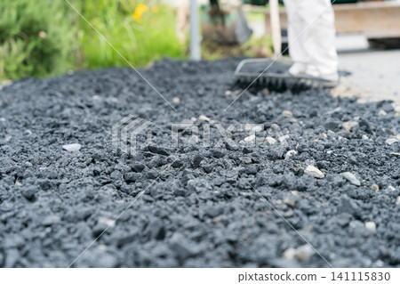 Spreading gravel Spreading gravel 141115830