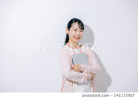 Woman using a laptop Woman using a laptop 141115987