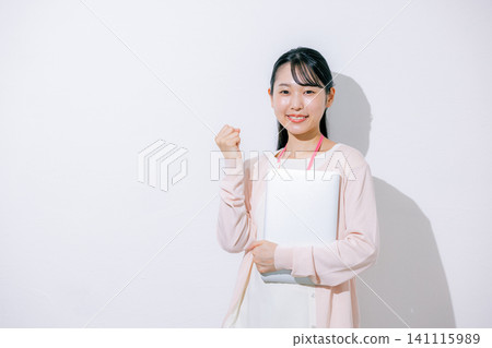 Woman using a laptop Woman using a laptop 141115989