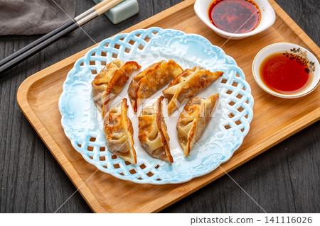 pan-Fried Pork Dumplings (Potstickers), Traditional Chinese Crispy Dumplings pan-Fried Pork Dumplings (Potstickers), Traditional Chinese Crispy Dumplings 141116026