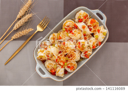 refreshing cold wheat gluten salad with garlic and chili sauce on a dark wooden table refreshing cold wheat gluten salad with garlic and chili sauce on a dark wooden table 141116089
