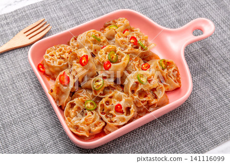 healthy cold buckwheat wheat gluten salad with chili and scallions on a white plate healthy cold buckwheat wheat gluten salad with chili and scallions on a white plate 141116099