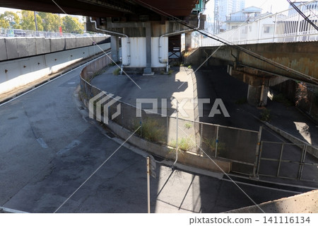 An example of a place where illegal dumping is likely to occur: under a road bridge overpass. An example of a place where illegal dumping is likely to occur: under a road bridge overpass. 141116134