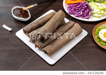 black Rice Pancake Rolls with Vegetables and Dipping Sauce, Chinese Street Food black Rice Pancake Rolls with Vegetables and Dipping Sauce, Chinese Street Food 141116240