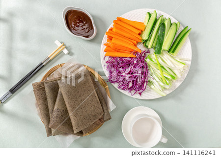 black Rice Pancake Rolls with Vegetables and Dipping Sauce, Chinese Street Food black Rice Pancake Rolls with Vegetables and Dipping Sauce, Chinese Street Food 141116241
