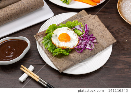 black Rice Pancake Rolls with Vegetables and Dipping Sauce, Chinese Street Food black Rice Pancake Rolls with Vegetables and Dipping Sauce, Chinese Street Food 141116243