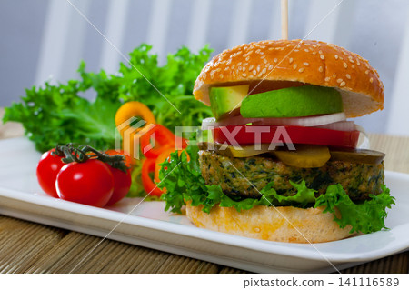Veggie burger with falafel and vegetables Veggie burger with falafel and vegetables 141116589