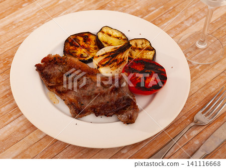 Grilled beef steak with grilled eggplant, onion and tomatoes Grilled beef steak with grilled eggplant, onion and tomatoes 141116668