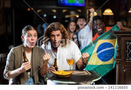 Brazil football team fans spending time in bar Brazil football team fans spending time in bar 141116885
