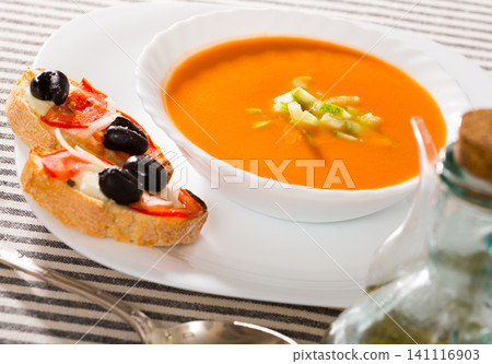 Spanish traditional cold soup gazpacho served with hot sandwiches Spanish traditional cold soup gazpacho served with hot sandwiches 141116903