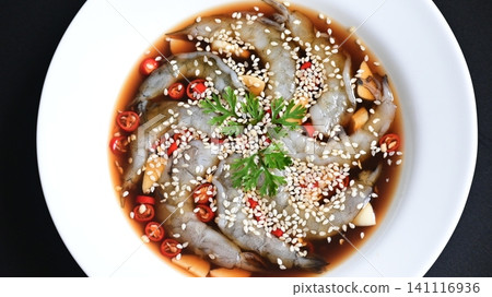 shrimp in soy sauce on white plate, korean style menu shrimp in soy sauce on white plate, korean style menu 141116936