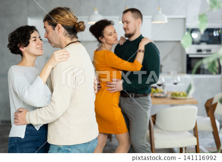 Men and women dancing during house party. Men and women dancing during house party. 141116992