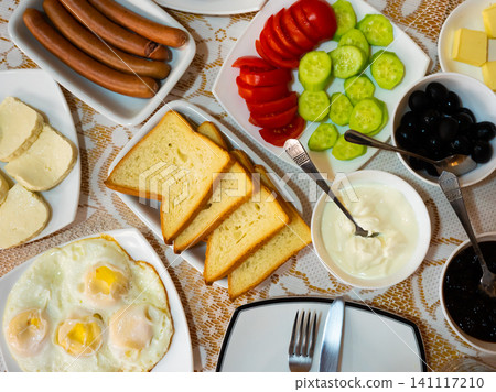 Breakfast in Georgian hotel with fried eggs, cheese, vegetables Breakfast in Georgian hotel with fried eggs, cheese, vegetables 141117210