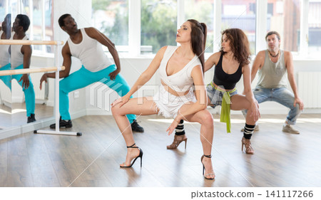 Girl in heels conducts lessons and teaches strip plasticity to visitors of dance Girl in heels conducts lessons and teaches strip plasticity to visitors of dance 141117266