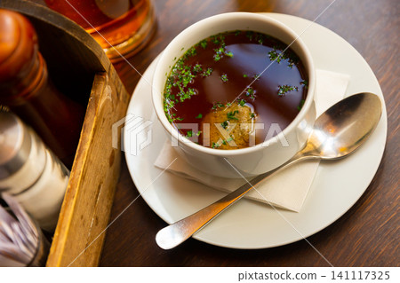 Bowl of beef soup with liver dumpling on table Bowl of beef soup with liver dumpling on table 141117325