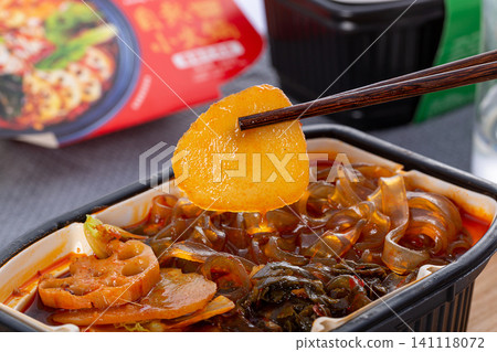 close-up of a self-heating spicy instant hot pot. close-up of a self-heating spicy instant hot pot. 141118072