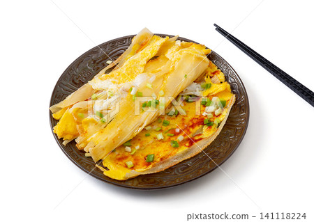 northeast Chinese street food grilled cold noodles with egg and scallions, isolated on white northeast Chinese street food grilled cold noodles with egg and scallions, isolated on white 141118224