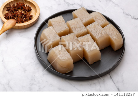 block of raw sweet potato starch jelly on a plate, traditional vegan ingredient for Asian cooking 141118257