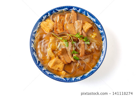 henan Anyang style flat glass noodles stewed with pork belly and tofu in a blue floral bowl 141118274