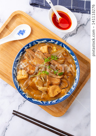 henan Anyang style flat glass noodles stewed with pork belly and tofu in a blue floral bowl 141118276