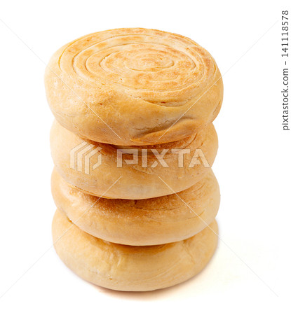 A stack of traditional Chinese Shaanxi style baked baijimo flatbread buns, isolated A stack of traditional Chinese Shaanxi style baked baijimo flatbread buns, isolated 141118578