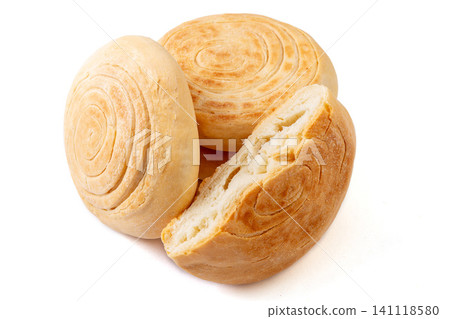 A stack of traditional Chinese Shaanxi style baked baijimo flatbread buns, isolated A stack of traditional Chinese Shaanxi style baked baijimo flatbread buns, isolated 141118580