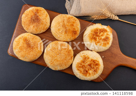 A stack of traditional Chinese crispy crusted shaobing flatbread buns, isolated A stack of traditional Chinese crispy crusted shaobing flatbread buns, isolated 141118598