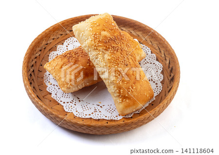 Traditional Chinese savory five spice crispy shaobing flatbreads in bamboo basket Traditional Chinese savory five spice crispy shaobing flatbreads in bamboo basket 141118604