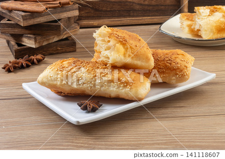Traditional Chinese savory five spice crispy shaobing flatbreads in plate Traditional Chinese savory five spice crispy shaobing flatbreads in plate 141118607