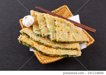 traditional Chinese Chive and Egg Stuffed Flatbread on Plate, Savory Homemade Street Food traditional Chinese Chive and Egg Stuffed Flatbread on Plate, Savory Homemade Street Food 141118609