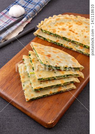 traditional Chinese Chive and Egg Stuffed Flatbread on Plate, Savory Homemade Street Food traditional Chinese Chive and Egg Stuffed Flatbread on Plate, Savory Homemade Street Food 141118610