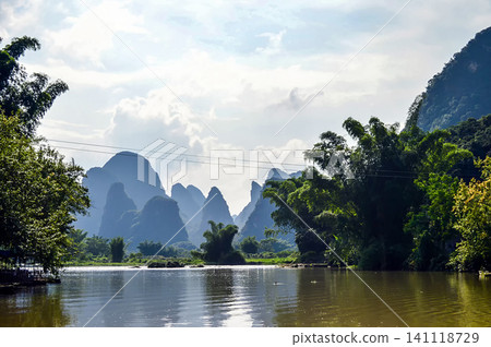 Scenic landscape of karst mountains along a river in Guilin, China Scenic landscape of karst mountains along a river in Guilin, China 141118729