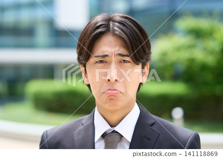 Asian businessman with a frown 141118869