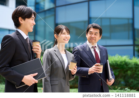 Business people walking and chatting during their break. Business people walking and chatting during their break. 141118881