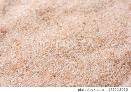 Fine, granular pink rock salt spreads across the entire screen. Fine, granular pink rock salt spreads across the entire screen. 141118910