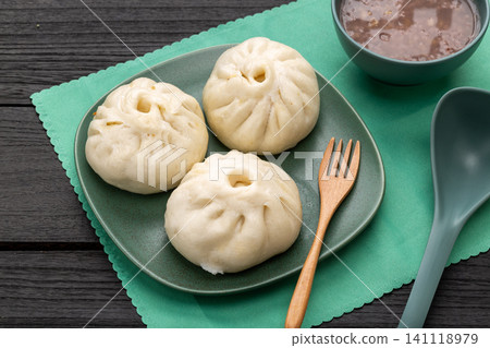 Chinese Mini Steamed Buns in Bamboo Steamer Traditional Dim Sum Chinese Mini Steamed Buns in Bamboo Steamer Traditional Dim Sum 141118979