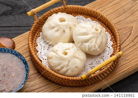 Chinese Mini Steamed Buns in Bamboo Steamer Traditional Dim Sum Chinese Mini Steamed Buns in Bamboo Steamer Traditional Dim Sum 141118981