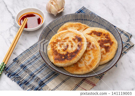 pan fried New Orleans style chicken meat pies on ceramic plate, Chinese stuffed flatbread breakfast pan fried New Orleans style chicken meat pies on ceramic plate, Chinese stuffed flatbread breakfast 141119003
