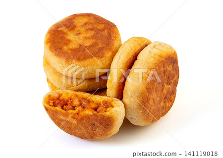 a stack of Chinese pan fried New Orleans chicken meat pies showing savory filling, isolated a stack of Chinese pan fried New Orleans chicken meat pies showing savory filling, isolated 141119018