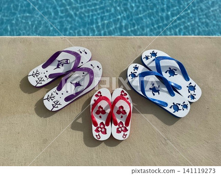 Resort hotel pool and a family of three wearing flip-flops Resort hotel pool and a family of three wearing flip-flops 141119273
