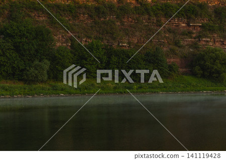 Dniester River flows through canyon landscape in Ukraine at sunrise Dniester River flows through canyon landscape in Ukraine at sunrise 141119428