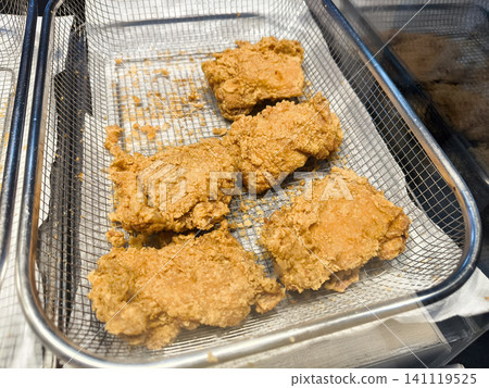 Fried chicken on a grill Fried chicken on a grill 141119525
