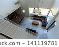 A modern living room in a resort hotel with a high ceiling. 141119781