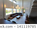 An open living room with a high ceiling 141119785